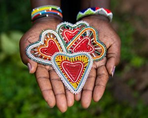 beaded ornaments in a hand