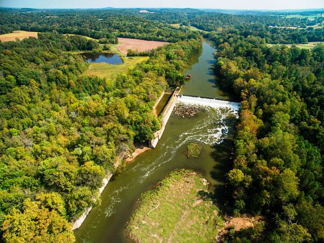 The Green River in Kentucky going through farms and forest.