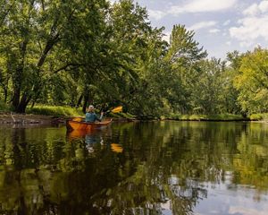 Phoebe MacPhail Townsend paddles on the Racquette River.