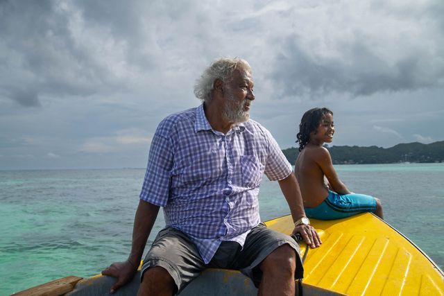 Man and grandson in boat.