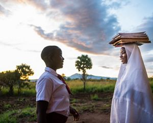 Two girls in school uniforms.